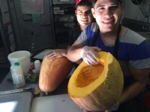 Picture of Cooks holding Candy Roaster Squash by 67 Biltmore Downtown Eatery and Catering